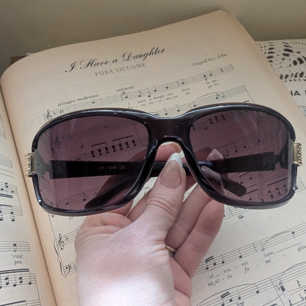 Stylish Black Sunglasses with Gold Accents